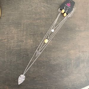 Silver and cream arrowhead layered necklace with matching earrings.
